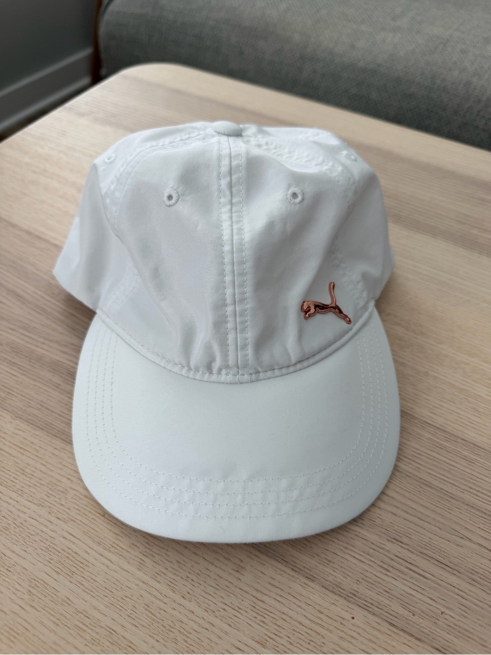 Puma White Cap with Rose Gold Puma Emblem